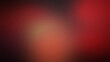 © Trendy_Desing - Dark red and black grainy gradient background with soft blurred light transitions and a subtle textured noise overlay for atmospheric depth
