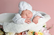© Svetlana - Newborn Baby Sleeping Peacefully in Bathtub with Spa Towel