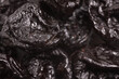 © yurchello108 - Heap of dried prunes close-up
