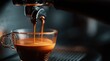 © dmmarychev - Espresso pouring from professional coffee machine into glass cup
