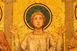 © Giorgio G - Close-up on golden mosaic  portraiting a young christian saint