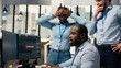 © DC Studio - Teamworking traders in office work together to resolve security alert after hacker uses exploit to penetrate systems. Team of prop firm colleagues brainstorm how to protect from cyberattack
