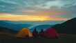 © waheed - A serene mountain landscape at sunset with two people camping in a peaceful natural setting