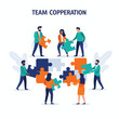 © Random - Diverse people assembling large puzzle pieces, symbolizing teamwork