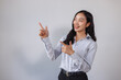 © crizzystudio - Smiling woman presenting information with pointing gesture