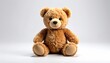 © cicilan - Adorable stuffed plush toy, brown teddy bear, seated with neutral background