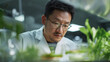 © INSPIRIA.K - Asian scientist examining plant sample in laboratory. Food technologist developing organic nutrition. Modern biotechnology research for sustainable food production and agriculture science.