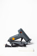 © abramov_jora - Gray Hot Glue Gun with Glue Stick on White Background
