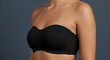 © Rasel - Woman wearing strapless black push-up bra vector illustration