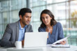 © REAL  - soft focus blurred photo of Professional business colleagues working on laptop, diverse corporate team analyzing data in modern office, coworkers collaborating on project