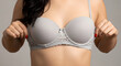 © Xoxen - Woman in gray lace bra showing lingerie