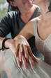 © colin - Close up of couple holding hands