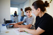 © Johnér - Boy listening to mother helping him while studying at home