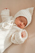 © Elena - Newborn baby lying on soft blanket