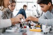 © Anna Lurye - Group of high school students working together on a modern robotics project in a classroom laboratory for stem education and teamwork concepts