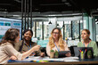© DC Studio - Diverse group of business partners analyzing project agenda fueled by collaboration and determination, aligning corporate goals to build a unified vision. Team networking concept.
