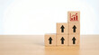© Gambar - Wooden Blocks Stacked in Upward Trend with Growth Chart