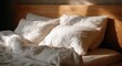 © rendy - Soft white bedding rests on a wooden bed, bathed in warm sunlight