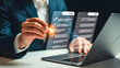 © Nashima Khatun - Digital Assessment: A modern individual, hands-on, is meticulously evaluating digital checklist, employing a digital pen, while working in an office with a laptop.