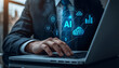 © Soffol_Stock - Businessman using laptop with AI technology interface for data analysis and business intelligence