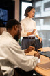 © Zoran Jesic - Asian businesswoman leading team meeting and presentation