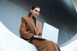 © VISTA by Westend61 - Businesswoman working on laptop outdoors in Barcelona