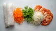 © rapaeh - A beautiful top-down arrangement of fresh ingredients for Vietnamese summer rolls featuring prawns, rice noodles, mint leaves, and julienned carrots.