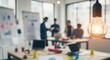 © Useful Elements - Creative team brainstorming in modern office with warm lighting and whiteboard