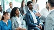 © Iryna - Diverse attendees listening to speaker in seminar room