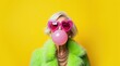© Alex Pios - A cheerful elderly woman wearing giant pink heart-shaped sunglasses, a neon green faux fur coat