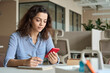 © insta_photos - Hispanic latin young teen girl college student holding smartphone studying on cell, distance learning using apps for education, elearning on mobile phone in university campus or creative office.