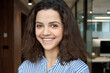 © insta_photos - Beautiful happy hispanic ethnic young adult 20s woman looking at camera, headshot. Smiling curly latin girl university student or professional close up face headshot.