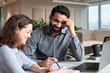 © insta_photos - Two happy diverse business people professional employees workers having discussion working together having fun at office meeting. Indian teacher and latin student having friendly conversation.
