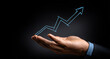 © Nan Shen - Businessman holding percentage graph symbol and up arrow. Concept of interest rate and tax calculation. Investment growth and profit. Dividend and long term investment to beat inflation
