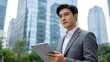 © Michael - Businessman with tablet in city