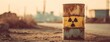 © Snowstudio - Rusted barrel with radioactive symbol in industrial background