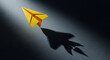 © MUHAMMAD - Yellow paper airplane casting a rocket-shaped shadow, symbolizing ambition and launch