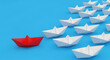© MUHAMMAD - Bold red paper boat leads the way, inspiring collective motion and demonstrating the essence of effective pioneering guidance
