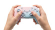 © Kawaiii_Biee - Hands holding a pastel pink and blue video game controller, ready for play.