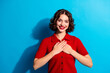 © deagreez - Young chic gorgeous woman smiling in red sweater against blue background