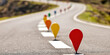 © ismail - Colorful road markers on a winding asphalt highway with white lane dividers