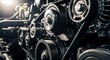 © Lucky - Close-up view of a complex automotive engine belt system with multiple pulleys.