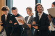 © chokniti - Business professionals discussing ideas in urban setting corporate communication teamwork consultation partnership strategy planning modern workplace collaboration