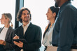 © chokniti - Business team meeting discussion collaboration presenting data analysis corporate teamwork diverse professionals planning strategy office communication partnership