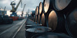 © Keopaserth - Oil barrel stacked at industrial port during moody sunset with shallow depth of field conveying gritty atmosphere