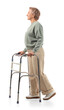 © Pixel-Shot - Mature woman using walker on white background