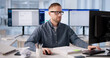 © Andrey Popov - Chartered Accountant Analyzing Tax Files With Cloud Technology