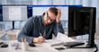 © Andrey Popov - Accountant Battles Software Glitches Leading To Stress