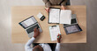 © Andrey Popov - Two Business Advisors, A Man And A Woman, Use Laptops While Discussing Budget