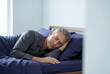 © Meow Creations - Peaceful middle aged man with glowing skin sleeping soundly in a bed